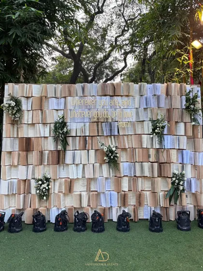 A truly unique photo backdrop I created from hundreds of open books, with a beautiful Rumi quote in gold. It's a testament to my love for creating things that don't exist.
