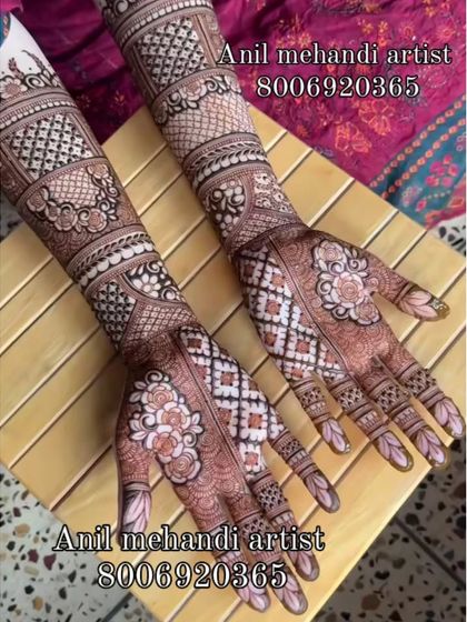 This design uses a repeating floral block pattern, creating a beautiful textile-like effect on the skin. It's a very neat and sophisticated style of bridal henna.