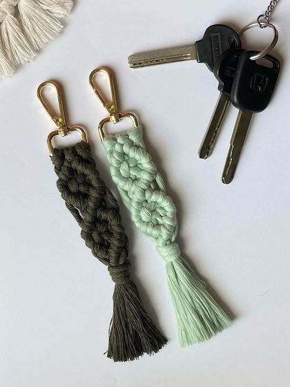 A pair of my diamond-pattern keychains in earthy green shades. These are perfect for attaching to your car or house keys.