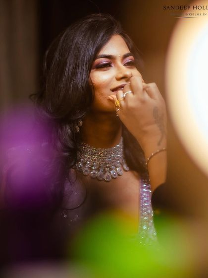 A candid, artistic close-up of the bride during her reception.