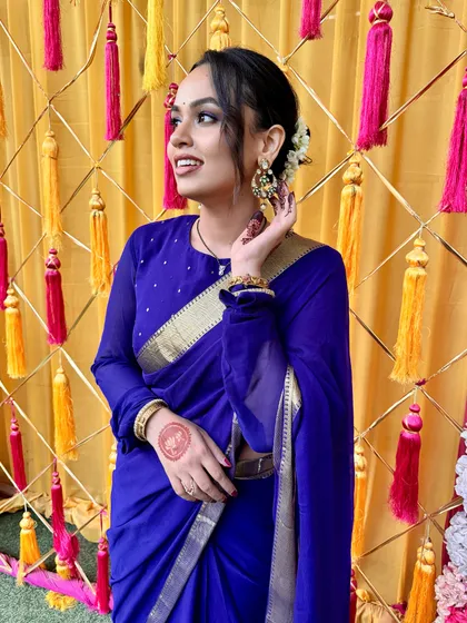 My Karwa Chauth look. A simple yet elegant blue saree paired with a soft, romantic updo and glowing makeup.
