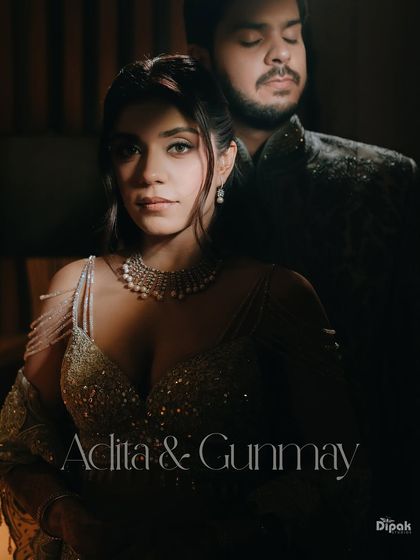 A dramatic and stylish portrait of a couple on their engagement day. The moody lighting and intense look create a powerful, high-fashion image.
