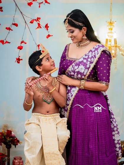 The bond between a mother and her child is truly special. For this Janmashtami themed shoot, we created a classic portrait of 'Yashoda' with her little Krishna, complete with traditional attire and a beautifully arranged studio setting.