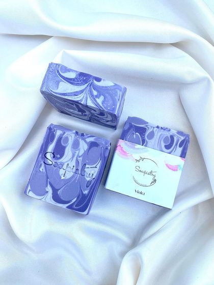 The "Vibes" soap bar, with its deep purple and white swirls.