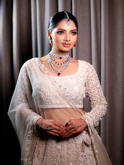 Another beautiful portrait of the bride in her white lehenga. The makeup is designed to be timeless, ensuring she looks back at her photos with love for years to come.