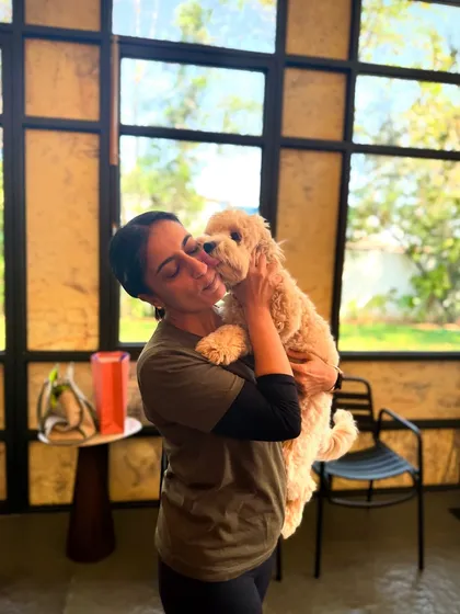A loving embrace with Goldie the Cockapoo. The bond we form with the dogs is truly special.