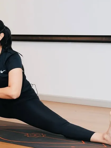 Corporate yoga is more than just stretching. I teach functional poses like this side lunge (Skandasana) to improve flexibility and strength, directly addressing the physical strains of a sedentary office job.