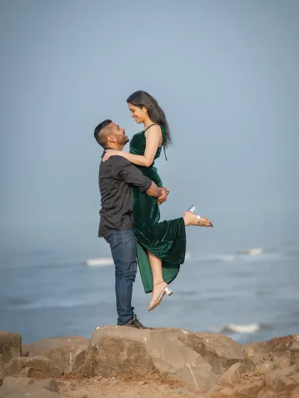 A classic "Dirty Dancing" lift against the backdrop of the sea. This is a fun and iconic pose that always results in a joyful and memorable pre-wedding photo.