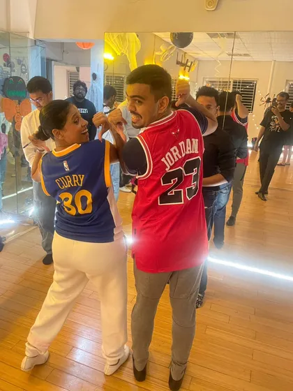 A little friendly rivalry on the dance floor. Students repping their favorite basketball teams, Curry vs. Jordan, at our Halloween social.