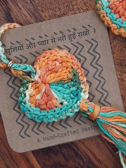 A close-up of the orange and green Lumba. The colors are so vibrant and festive, perfect for the occasion.