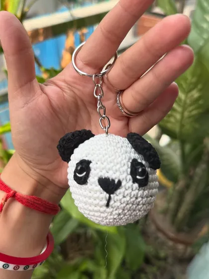 This little panda keychain is ready to hang out. It's a small, cute accessory that brings a smile wherever it goes.