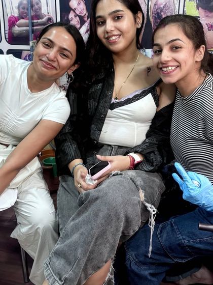 My artist Disha with happy clients. We make sure everyone feels comfortable and leaves with a tattoo they love.