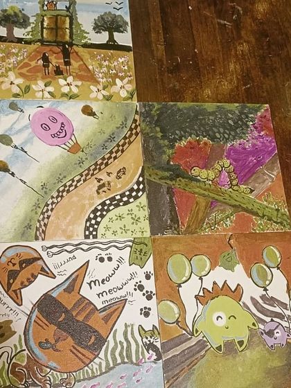 A close-up of the six unique canvases created by one group during a Canvas Carousel event. It's amazing to see the diverse styles and ideas that come together.