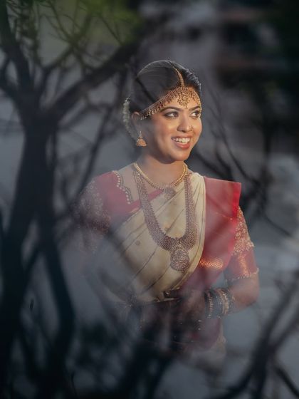 A creative shot of the bride. The makeup looks flawless even in artistic lighting, showing its versatility for different types of wedding photography.