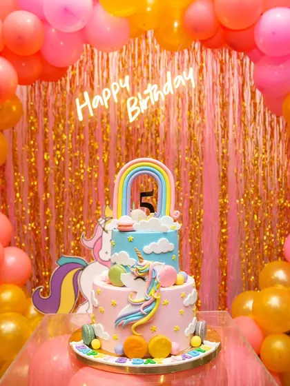 The beautiful unicorn rainbow cake as the centerpiece of the party decor.