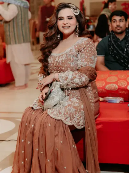 Another angle of this elegant festive look. The intricate embroidery on the kurta and the flowing sharara pants make it a comfortable yet glamorous choice for a family function or celebration.