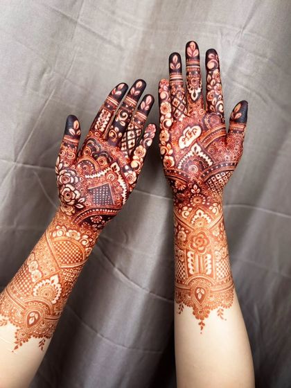 A full view of the palms, showing the deep, dark stain from the organic henna.