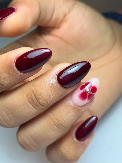 A close-up of the hand-placed dried flower, sealed under a glossy top coat for a smooth finish.