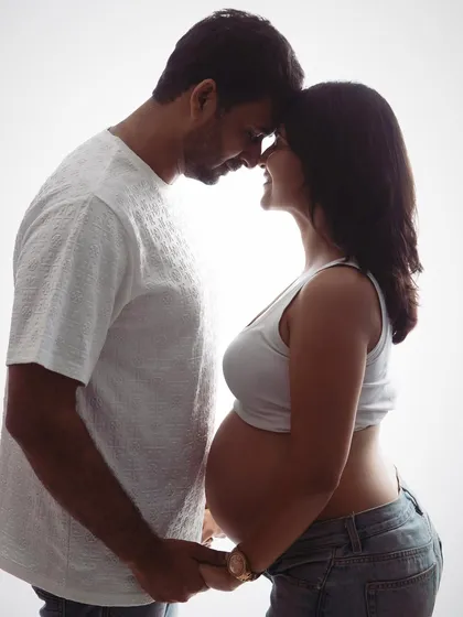 Just the two of you, waiting for the little one. This backlit silhouette is a beautiful and intimate way to capture the connection and anticipation you share as a couple.
