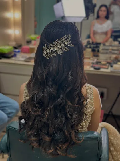 A close-up of the engagement hairstyle, showing the intricate detail of the leafy hair accessory.