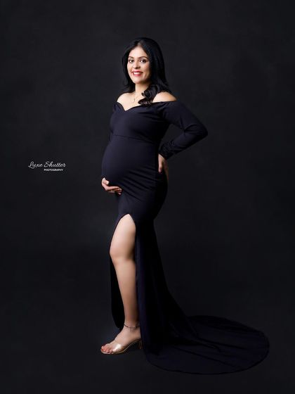 A confident and happy portrait in a simple black gown. This look is perfect for creating elegant and timeless maternity photos that focus on you.
