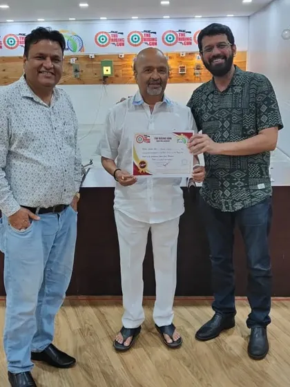 An adult student is awarded his certificate after finishing the basic course. It's never too late to learn a new skill, and shooting is a fantastic way to improve focus and discipline.
