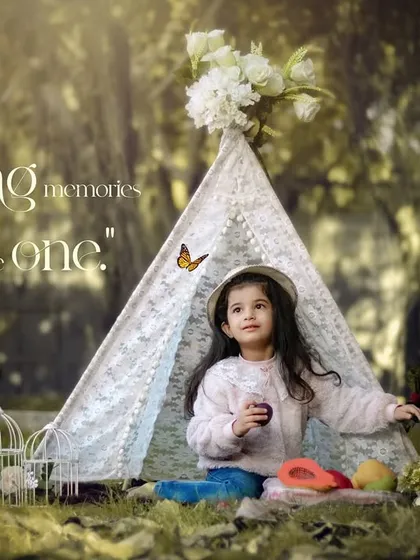 Making memories with my little one. A girl enjoys a picnic in her teepee in a sun-dappled forest.