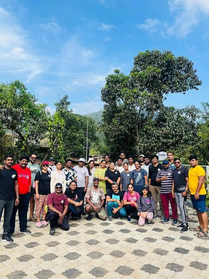 The full group from a Netravathi trek, posing together at the homestay.