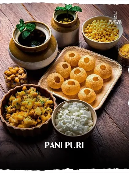 Nothing brings more energy to an event than a live chaat counter. Here is our classic Pani Puri station, meticulously arranged with all the fixings, promising a hygienic, fun, and flavorful bite every time.