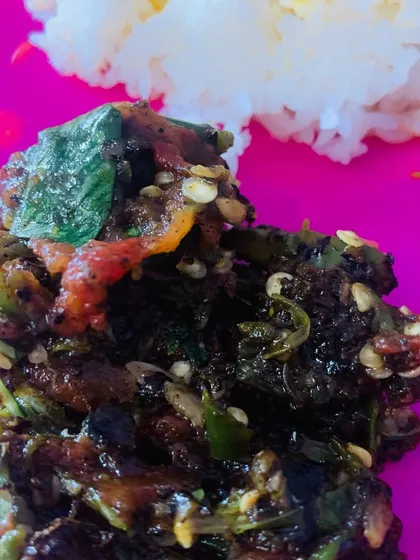 A close-up of my Aneshi chutney, made with fermented taro leaves, roasted chillies, and tomato. You can see the texture from all the pounded ingredients.