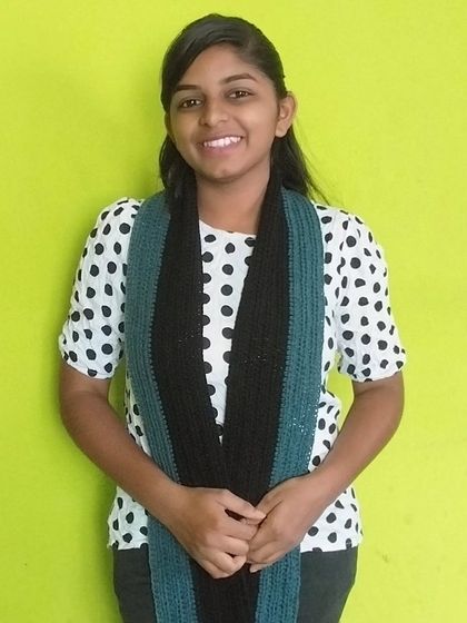 A casual, open way to wear the handmade muffler.