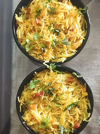 Two bowls of my homemade vegetable vermicelli (seviyan upma). It's a light, healthy, and tasty breakfast option.