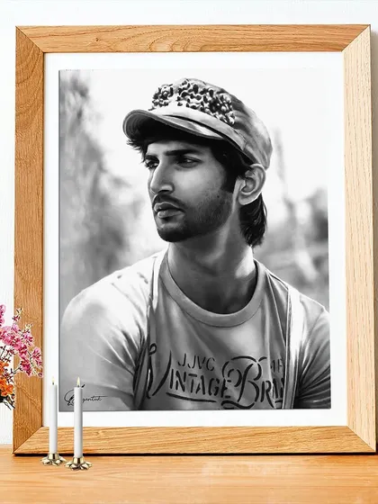 This is a memorial portrait of Sushant Singh Rajput, framed to show how it would look as a physical piece of art. It was created as a tribute by special request, capturing a quiet moment.