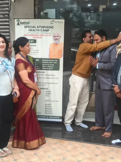 Sharing a warm moment of gratitude with an organizer at the health camp. The success of these events is always a team effort, driven by a shared passion for wellness.