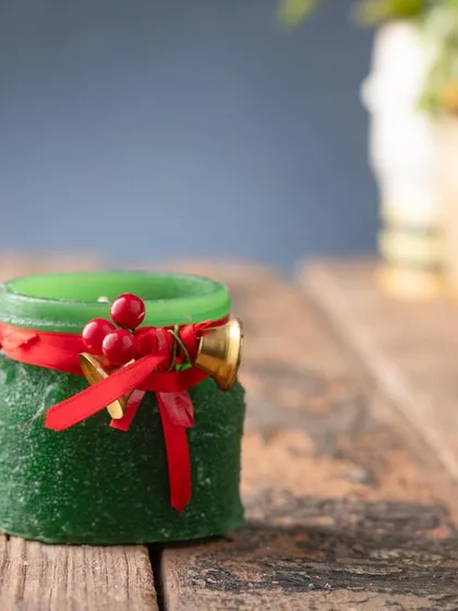 The green version of my Christmas jar candle, with a simple red ribbon and festive embellishments.