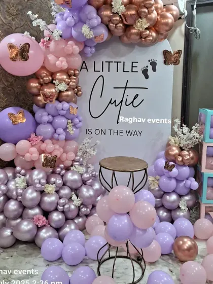 A modern and elegant baby shower decoration with the theme "A Little Cutie is on the way". I used a mix of pastel purple, pink, and chrome rose gold balloons with a custom backdrop and 'BABY' boxes.
