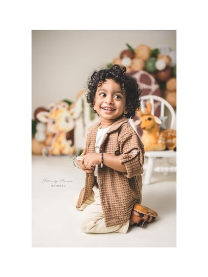 Wild, free, and turning two! This little explorer is ready for adventure in his jungle-themed second birthday photoshoot.