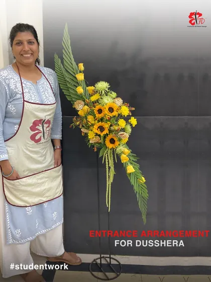 This stunning entrance arrangement for Dussehra was created by a student in our 9-month course. The design uses sunflowers and yellow roses to create a bright, welcoming, and festive statement piece.