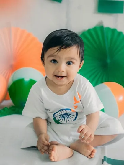 This little one's smile is as bright as our nation's future. A perfect portrait from his first Independence Day shoot.
