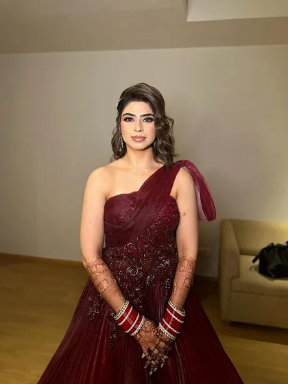 The full look for Jasleen's reception, showcasing her elegant gown and the sophisticated makeup to match.