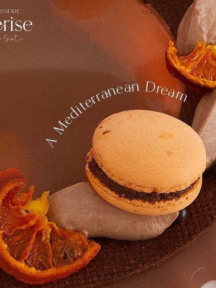 A Mediterranean dream. This close-up shows the details of the Valencian Sunshine, from the candied orange slices to the orange-flavored macarons.