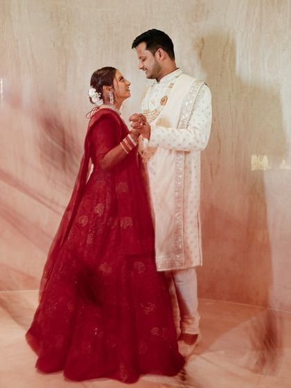 An artistic shot using a slow shutter speed to create a beautiful light trail effect around Katyayni and Kunal. This technique adds a sense of magic and movement to their portrait.