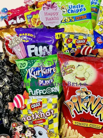 A close-up of the delicious chaos in our snack-loaded Rakhi hamper. We've included a variety of classic Indian chips and treats for a nostalgic touch.