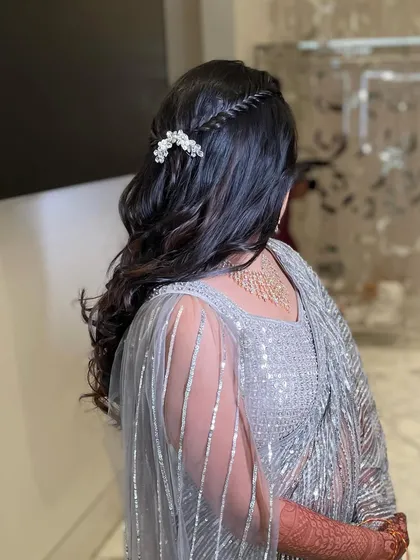 A side view of this pretty reception hairstyle. It's a look that is both romantic and modern, perfect for a bride who wants something understated.