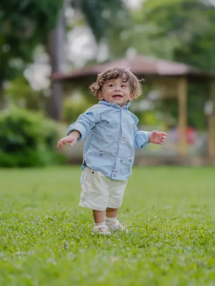 Capturing a moment of pure, spontaneous joy during an outdoor photoshoot in a Mumbai park. My goal is to photograph authentic expressions and natural movements.