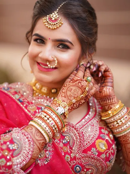 A close-up of this radiant bride. The makeup is kept soft and clean to highlight her features and traditional jewelry.