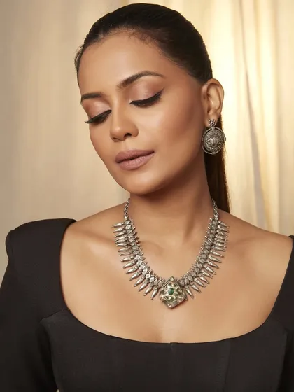 Another angle from the jewelry shoot, showing the model looking down. This highlights the beautiful shape of the winged liner and the soft, neutral tones on her eyelids.
