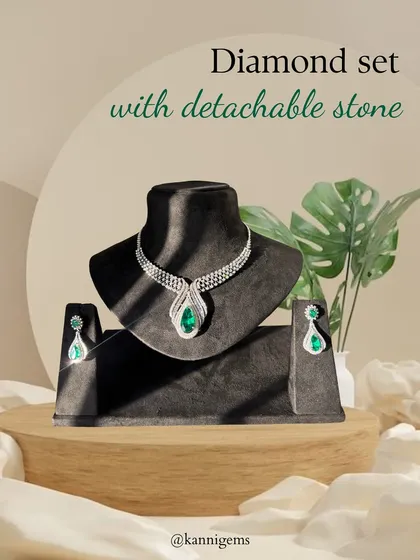 Two looks, one masterpiece. This diamond set is shown here with the vibrant emerald stone, offering a classic and regal look that can be easily swapped for a different mood.