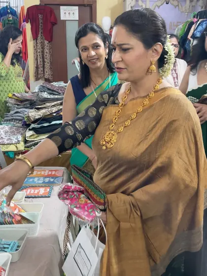 A candid shot of a customer, actress Alka Kubal, browsing through my collection at an exhibition.