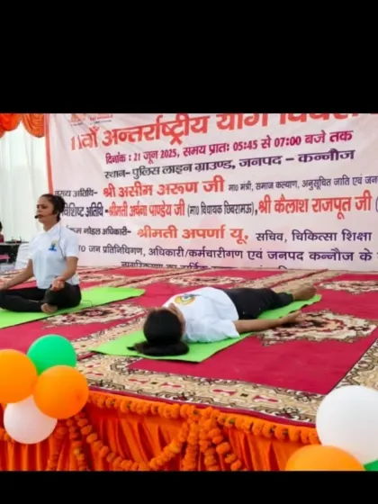 Demonstrating asanas on stage alongside other instructors. For large events, clear and synchronized instruction is key to a successful session.